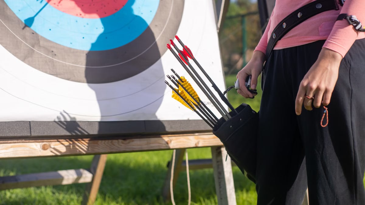 A close-up view of an archery target and arrows in a quiver outdoors in Portugal.